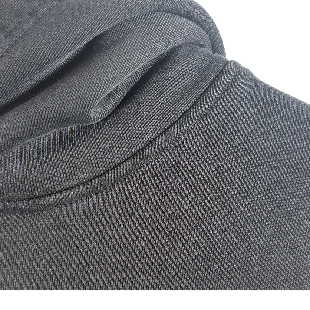 Close-up of hoodie fabric showing heavyweight organic material and stitching